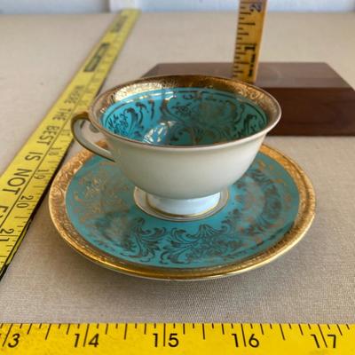 Teal and gold tea cup and saucer