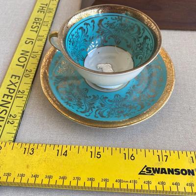 Teal and gold tea cup and saucer