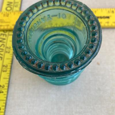 Vintage green glass insulator