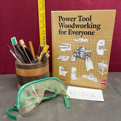 Power tool book, pencil cup and safety goggles