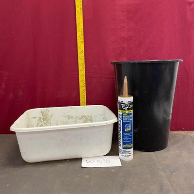Tub, caulking and trash can