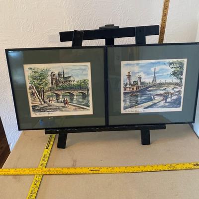 Two wall hangings of Paris scenes