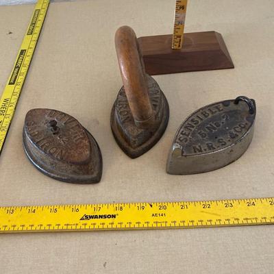 Three antique irons