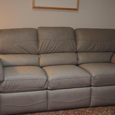 LEATHER SOFA IN SOFT GREY RECLINING ON BOTH ENDS. VERY GOOD CONDITION!