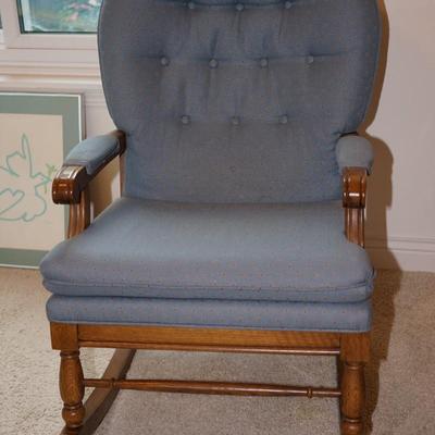 COMFORTABLE WOOD FRAMED ROCKER UPHOLSTERED IN A BLUE FABRIC
