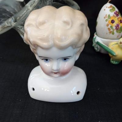 LOT 18  GLASS BASKET, PORCELAIN DOLL HEAD AND CANDLE EGG ON CART