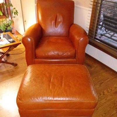 LOT 86  ARMED LEATHER LOUNGE CHAIR WITH OTTOMAN