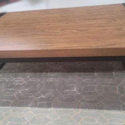 Modern wood and metal cocktail table 
H13" W55" D28"
$299