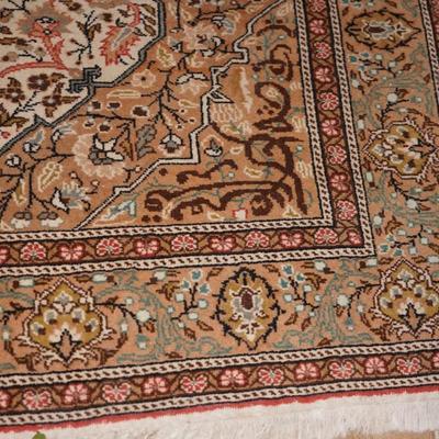 ORIENTAL RUG IN BROWN COLORS ON IVORY 7' BY 5'