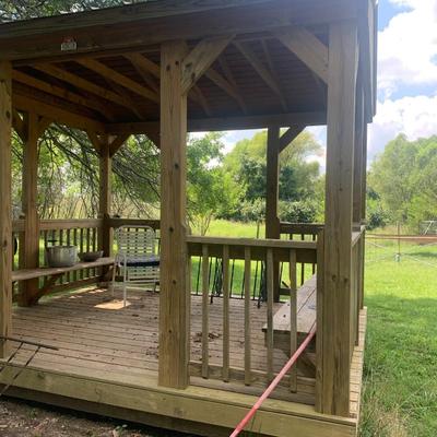 very nice treated wood Derkson gazebo w/ built in benches and metal roof.