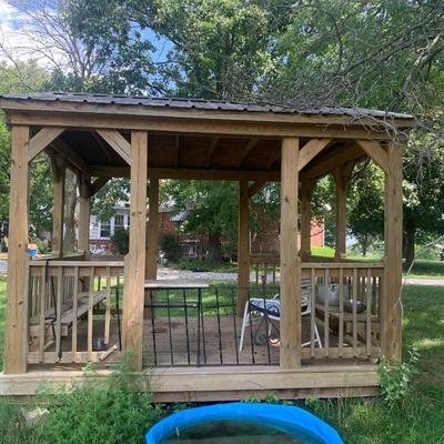 very nice treated wood Derkson gazebo w/ built in benches and metal roof.