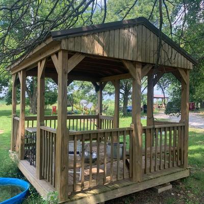 very nice treated wood Derkson gazebo w/ built in benches and metal roof.