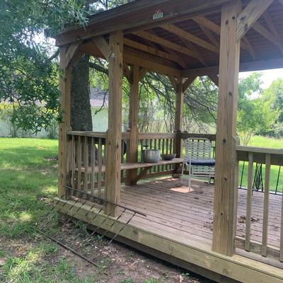 very nice treated wood Derkson gazebo w/ built in benches and metal roof.