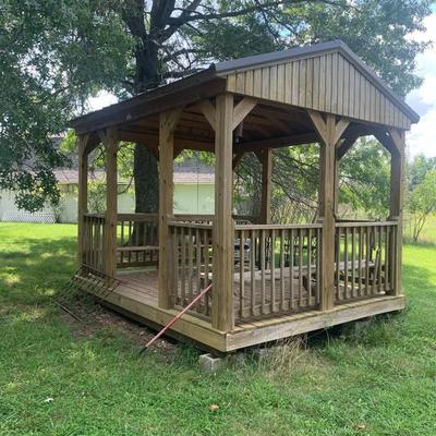 very nice treated wood Derkson gazebo w/ built in benches and metal roof.