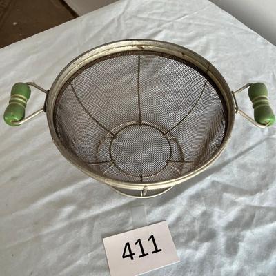 Jadeite colored handled collander/ strainer.