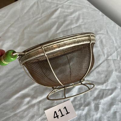 Jadeite colored handled collander/ strainer.