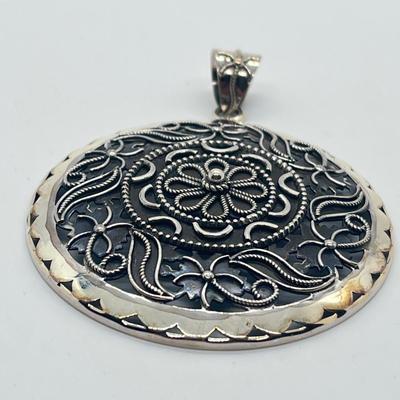 LOT 60: Artisan Crafted Sterling Silver Round Pendant