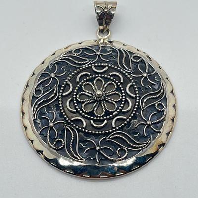 LOT 60: Artisan Crafted Sterling Silver Round Pendant