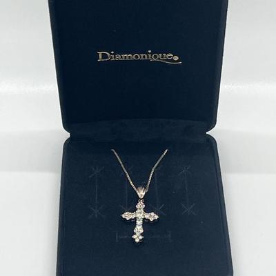 LOT 62: Sterling Silver Diamonique Cross Pendant on 20