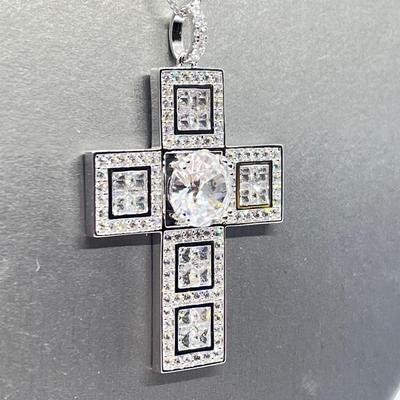 LOT 65:  Diamonique Sterling Silver Cross on 24