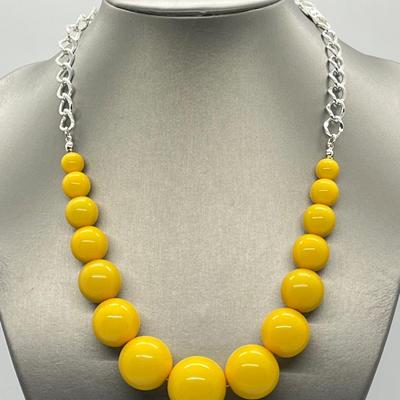 LOT 88: Three-Piece Wardrobe - Yellow Lucite Bead Necklace, Earrings and Stretch Bracelet Set