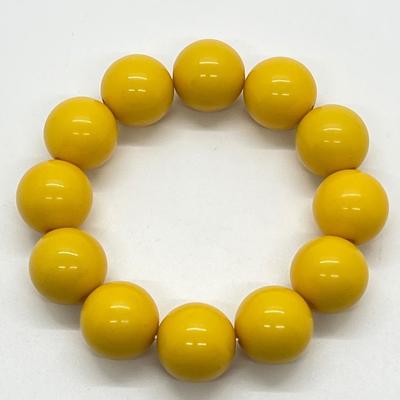 LOT 88: Three-Piece Wardrobe - Yellow Lucite Bead Necklace, Earrings and Stretch Bracelet Set