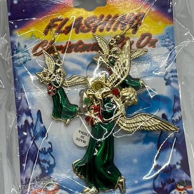 LOT 130: Four Sets Flashing Christmas Pins with Matching Earrings - Sealed, Untested