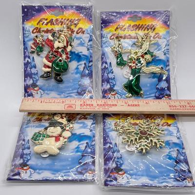 LOT 130: Four Sets Flashing Christmas Pins with Matching Earrings - Sealed, Untested
