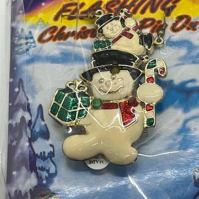 LOT 130: Four Sets Flashing Christmas Pins with Matching Earrings - Sealed, Untested