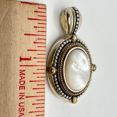 LOT 176: Sterling Silver Pendant Marked GV
