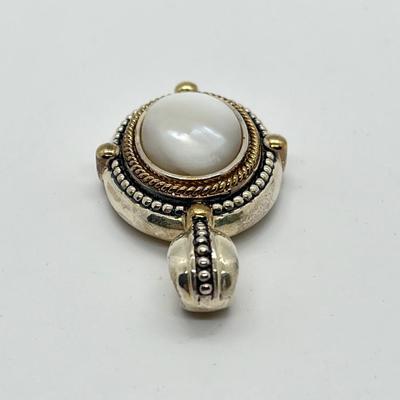 LOT 176: Sterling Silver Pendant Marked GV