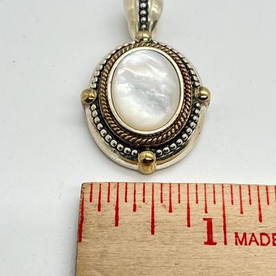 LOT 176: Sterling Silver Pendant Marked GV