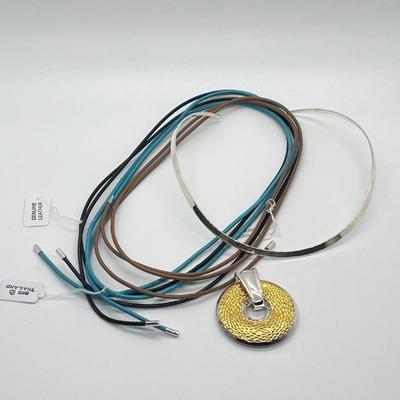 LOT 183: Sterling Silver Reversible Pendant w/Collar and three Colored Leather Cords