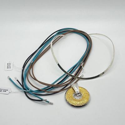 LOT 183: Sterling Silver Reversible Pendant w/Collar and three Colored Leather Cords
