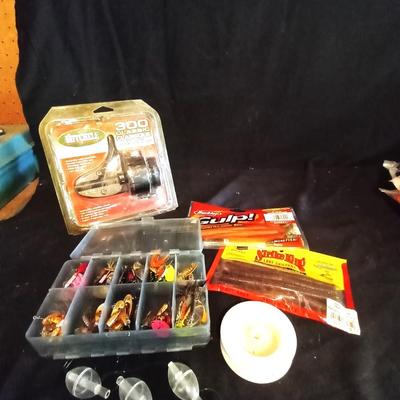 LOT 28 NEW MITCHELL FISHING REEL AND LURES