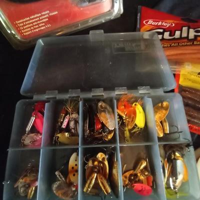 LOT 28 NEW MITCHELL FISHING REEL AND LURES
