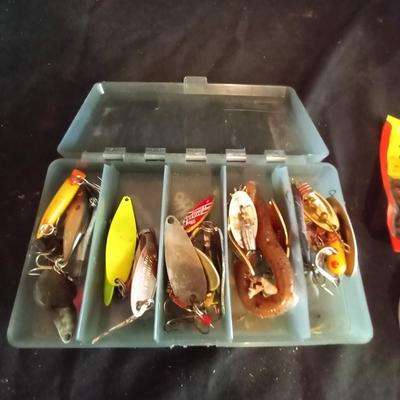 LOT 28 NEW MITCHELL FISHING REEL AND LURES
