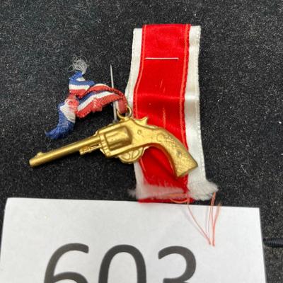 Cast Revolver Pendant with Ribbon