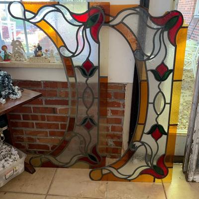 A set of stain glass window toppers out of frame