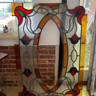 A set of stain glass window toppers out of frame