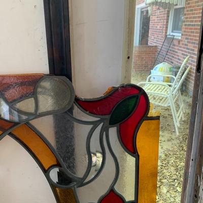 A set of stain glass window toppers out of frame