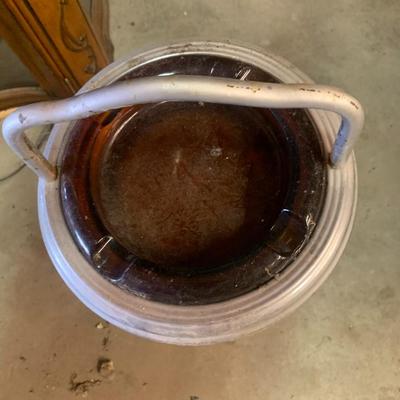 old metal stand with amber glass ashtray