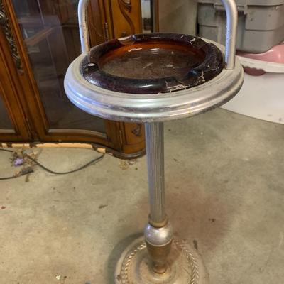 old metal stand with amber glass ashtray