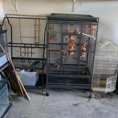Very large vintage bird cage with lots of misc inside.