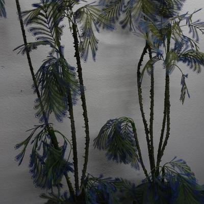 LOT 163 TWO  VINTAGE PLASTIC DECORATIVE PLANTS.  (65" TALL)