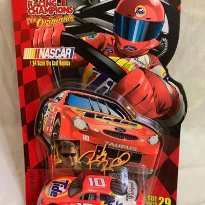 3 NASCAR items - 2 cars and 1 Starting Lineup Figure 4.5â€ tall approx