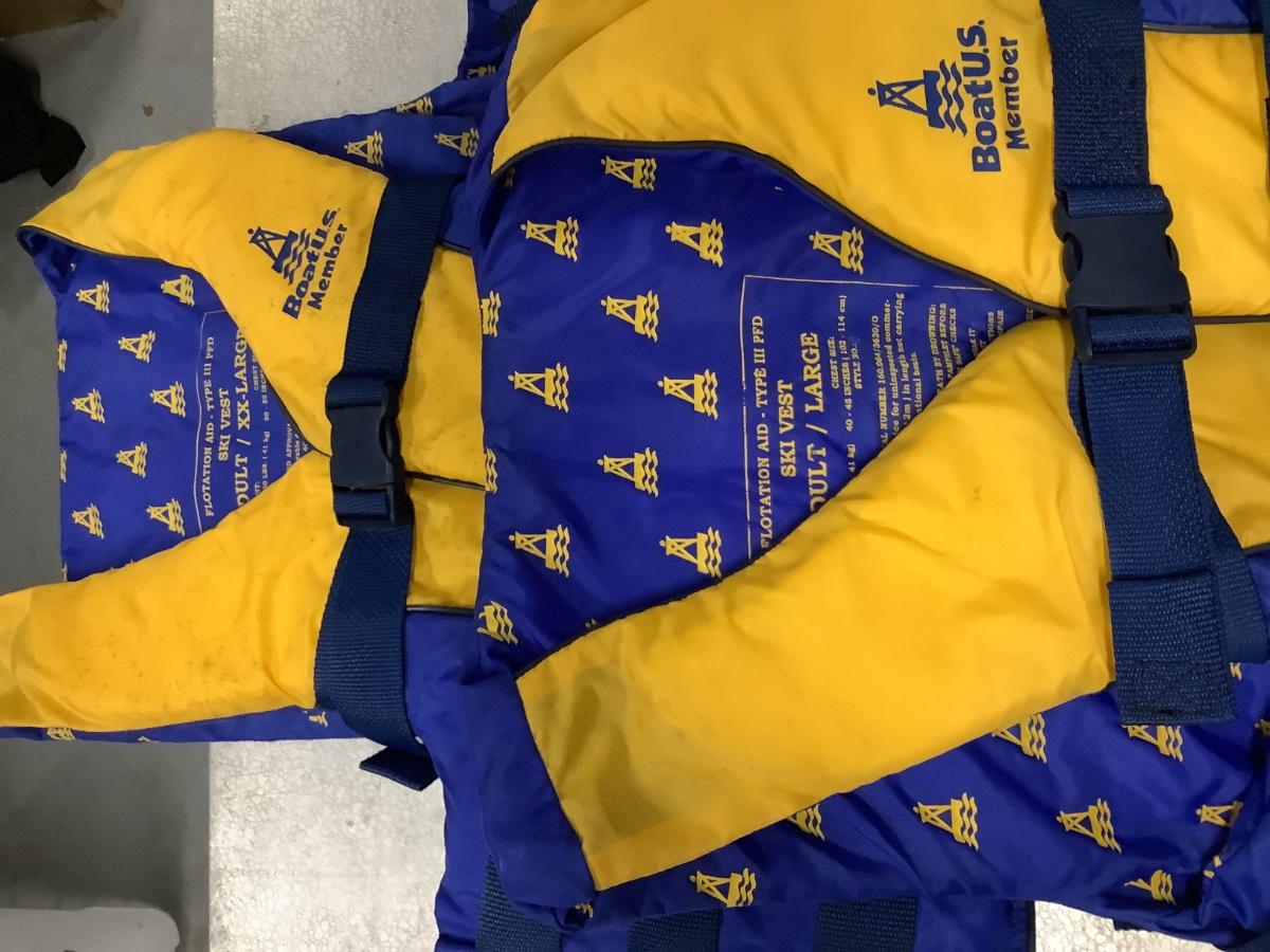 2 Men’s yellow & blue life vests | EstateSales.org