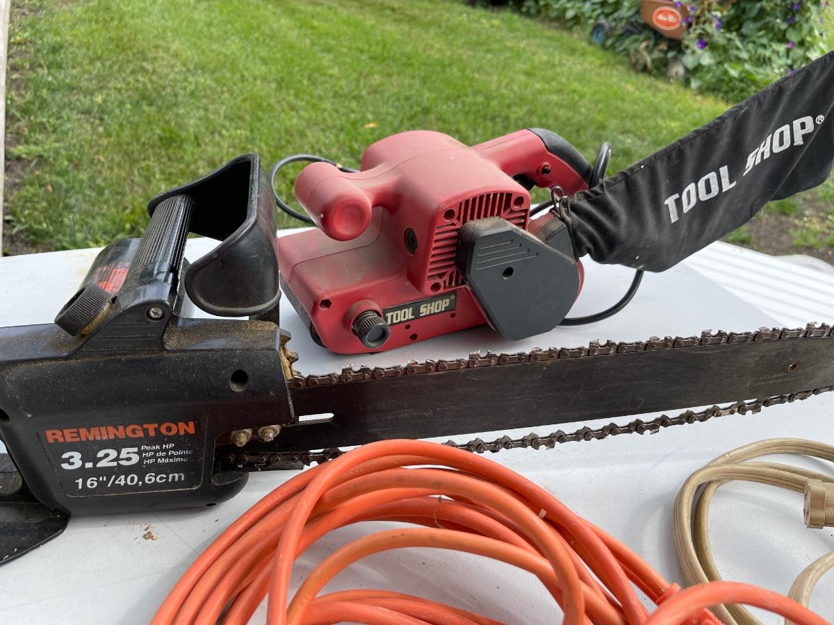 LS27Chainsaw, belt sander. and cords