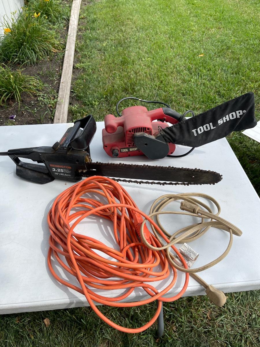 LS27Chainsaw, belt sander. and cords