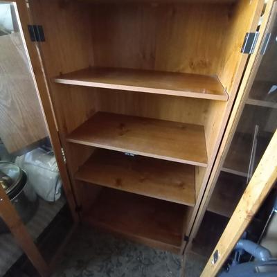 LOT 48 THREE SHELF WOODEN GLASS FRONT CABINET